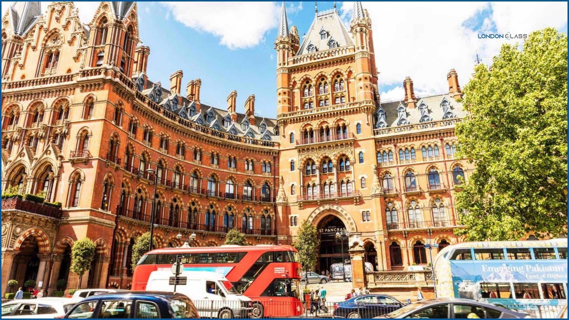 Exterior of St. Pancras Renaissance Hotel with red brick facade and London bus