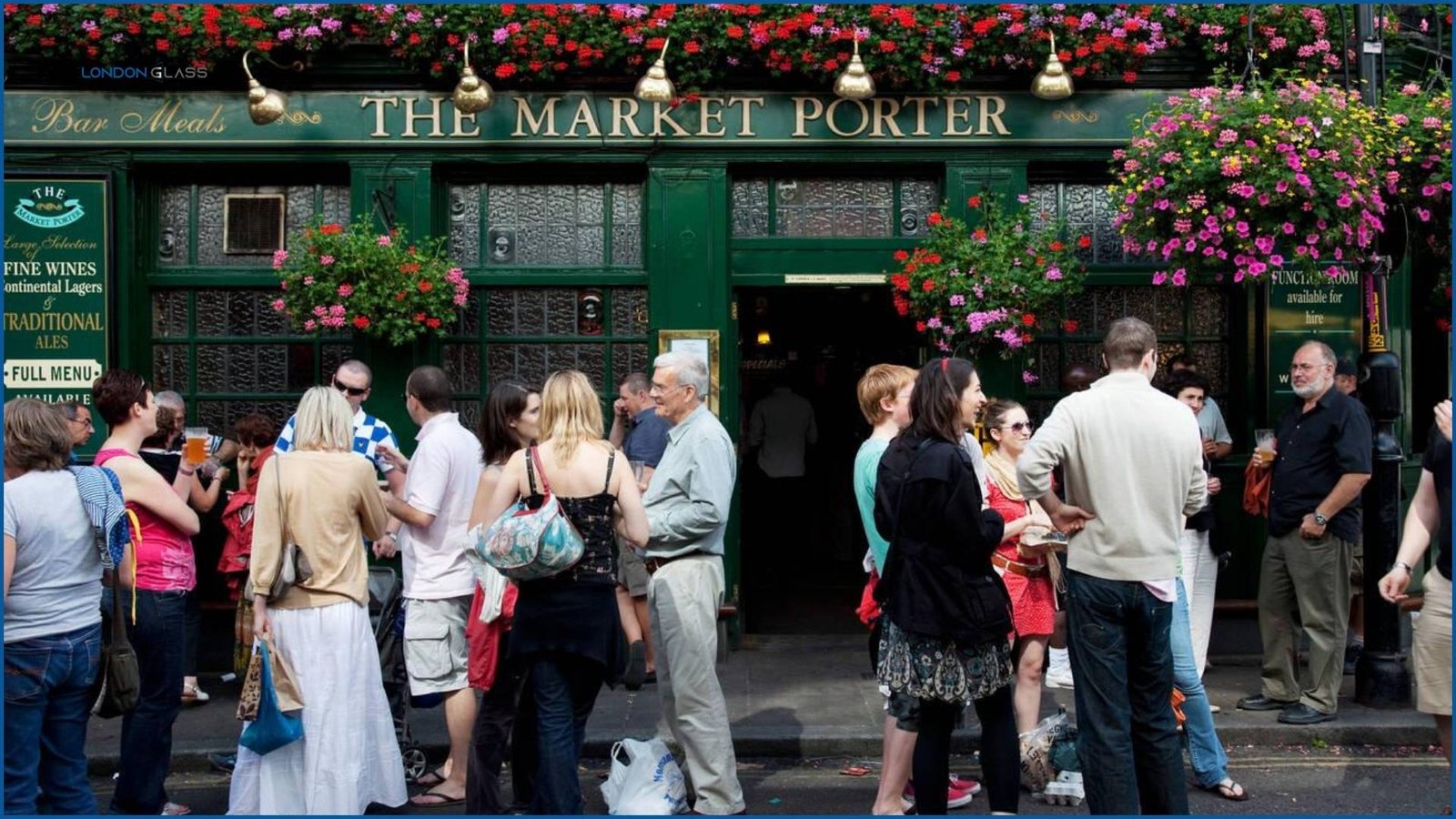 People enjoying drinks outside The Market Porter pub at Borough Market.