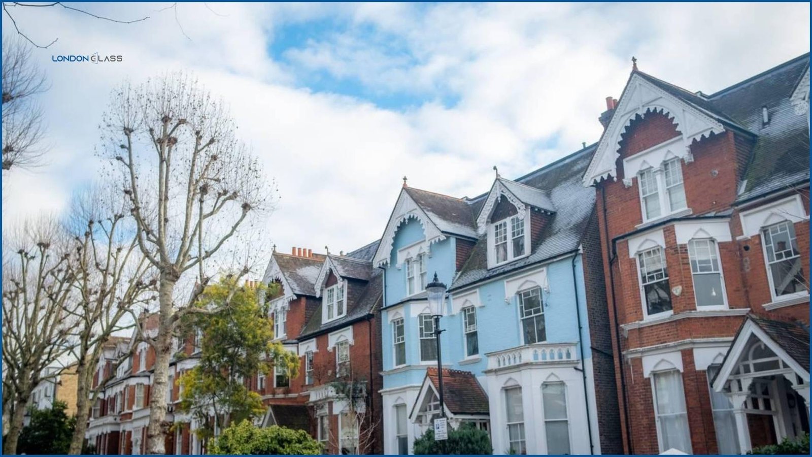 Row of Victorian terraced houses along a tree-lined street in Latimer Road