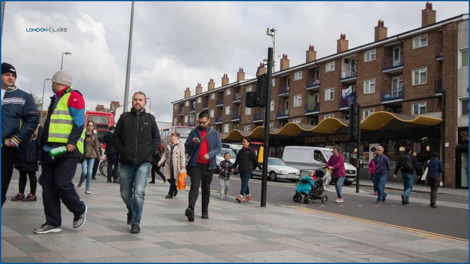 Pedestrians and local residents walking in front of Central Parade in Walthamstow.