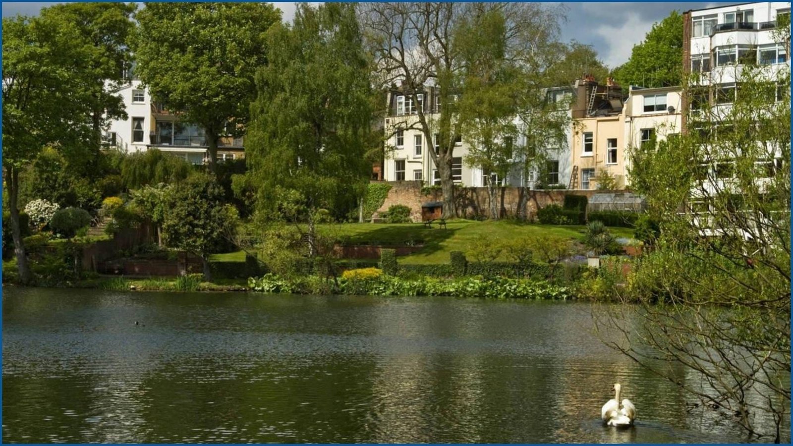 Serene view of residential houses by the pond in the Vale of Health, Camden