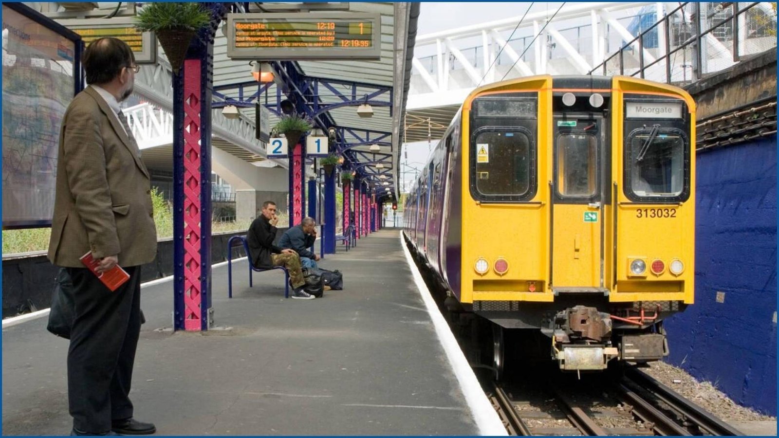 Yellow train at Drayton Park Station platform