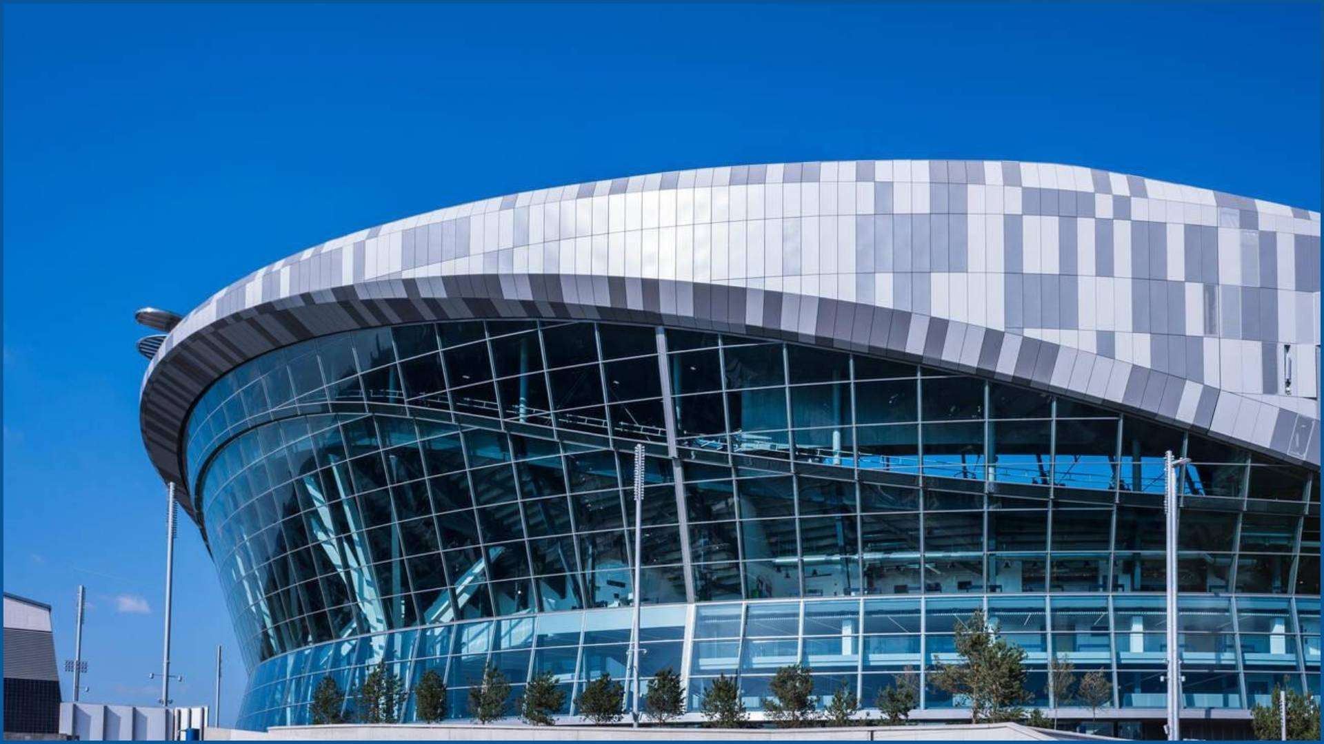 Modern architectural design of the Tottenham Hotspur Stadium.