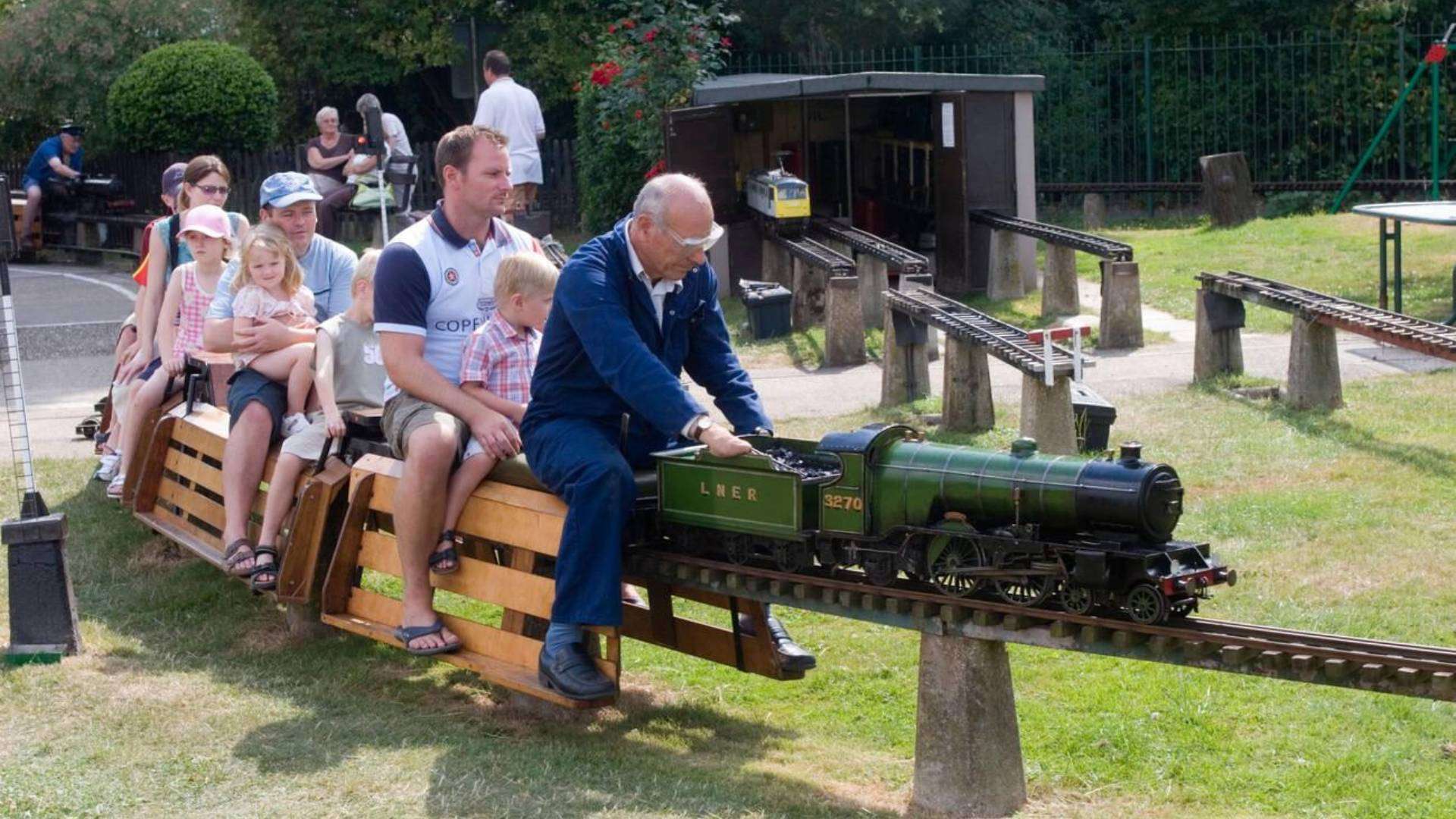 Family enjoying a miniature steam train ride at Ridgeway Park