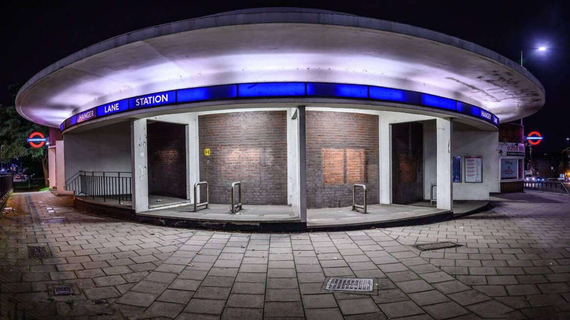 Night view of the circular architecture of Hanger Lane Station in Ealing.