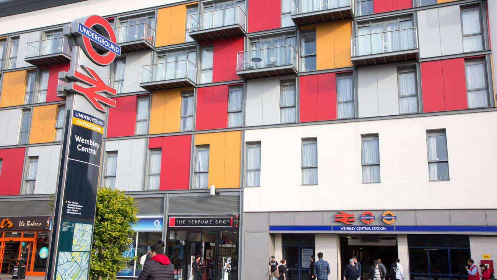 Wembley Central Station facade with bright, colorful designs near Sudbury London.