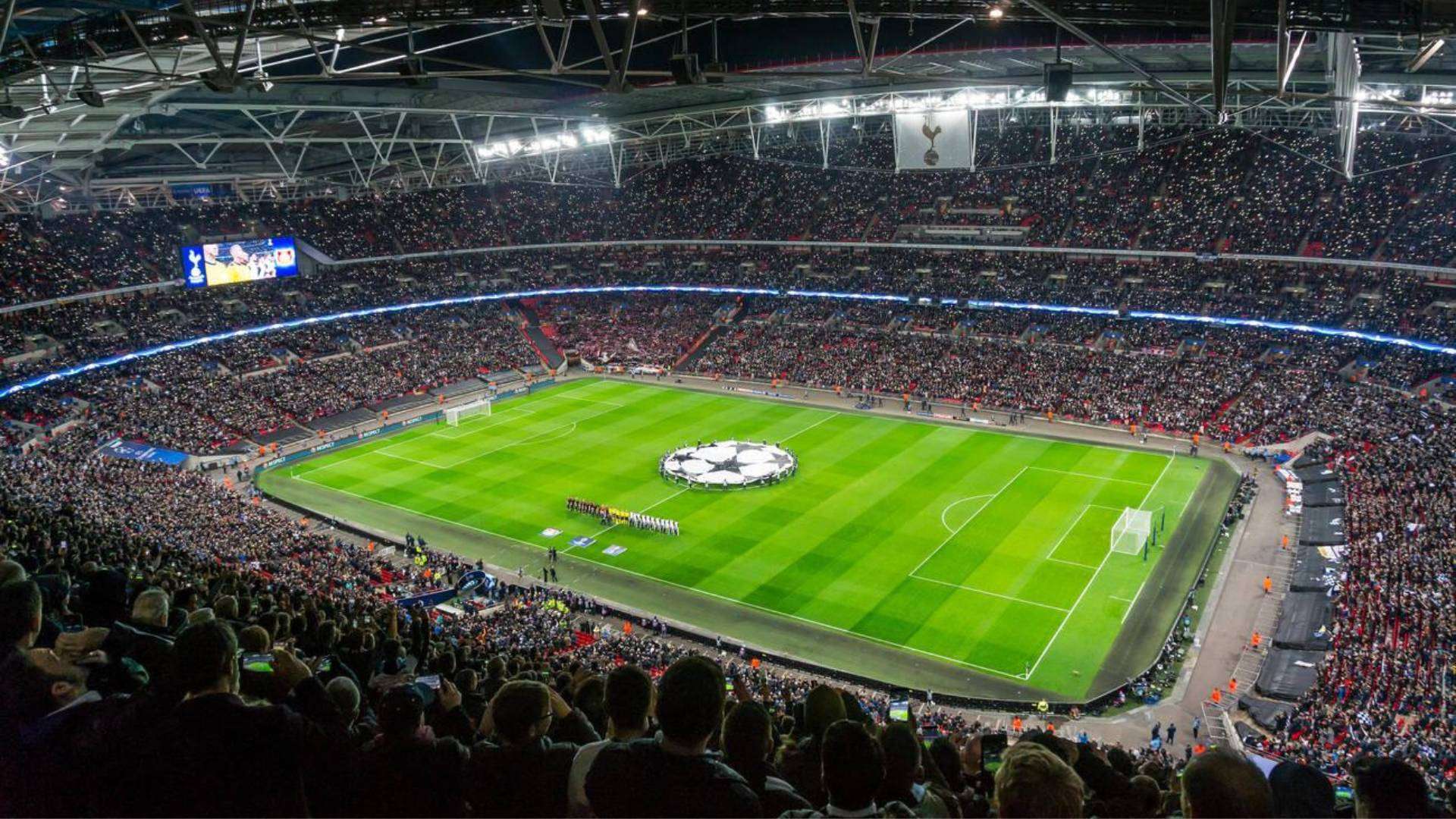 Panoramic view of Tottenham football stadium during a Champions League match.