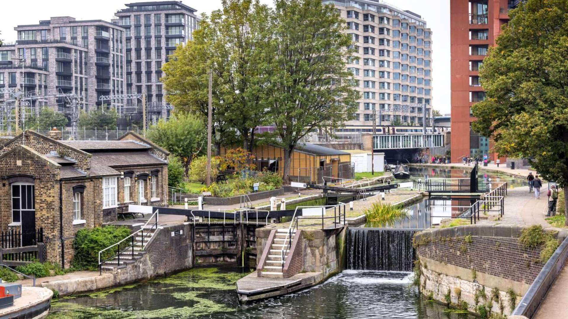 Scenic Regent’s Canal Towpath in Haggerston, East London, with modern and historic architecture.