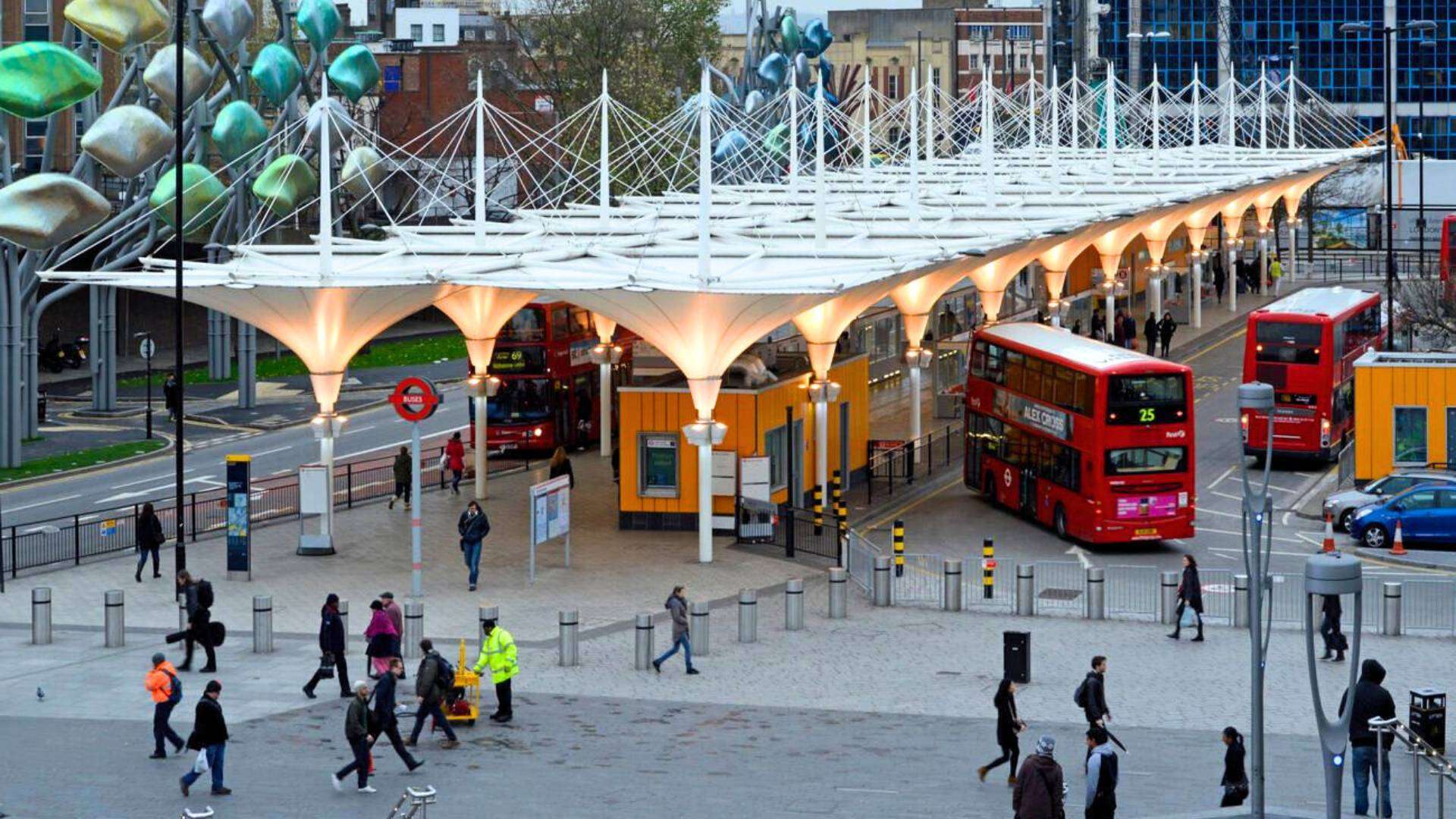 Stratford Bus Station with red double-decker buses in East London.